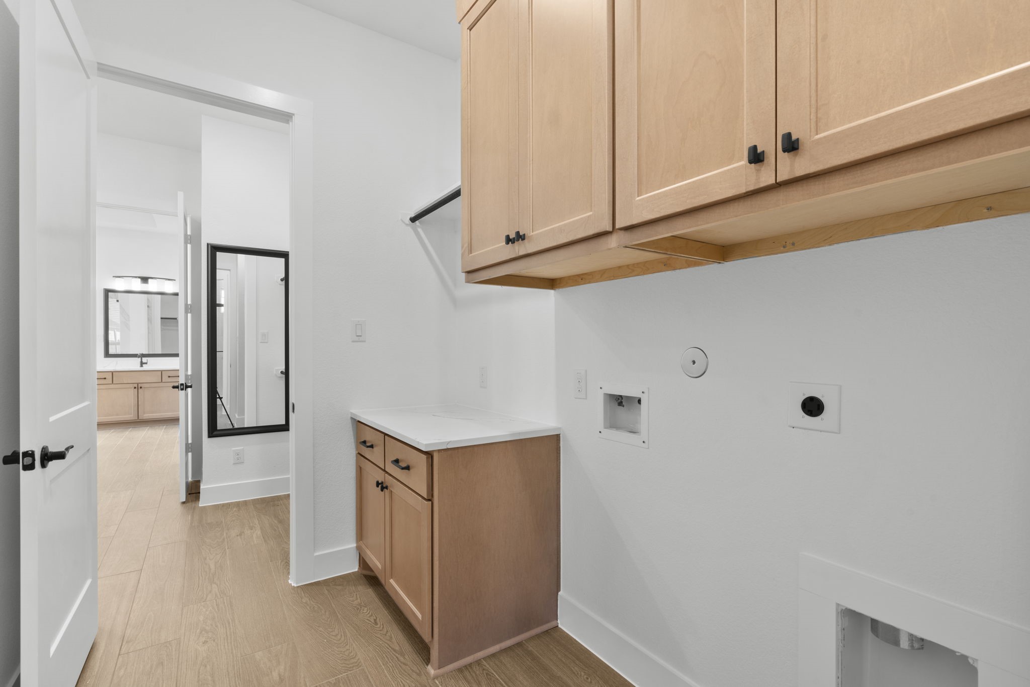 407 Blue River Trail Rosenberg, TX 77471 - Photo 8 of 45 a view of a kitchen with cabinets and a refrigerator