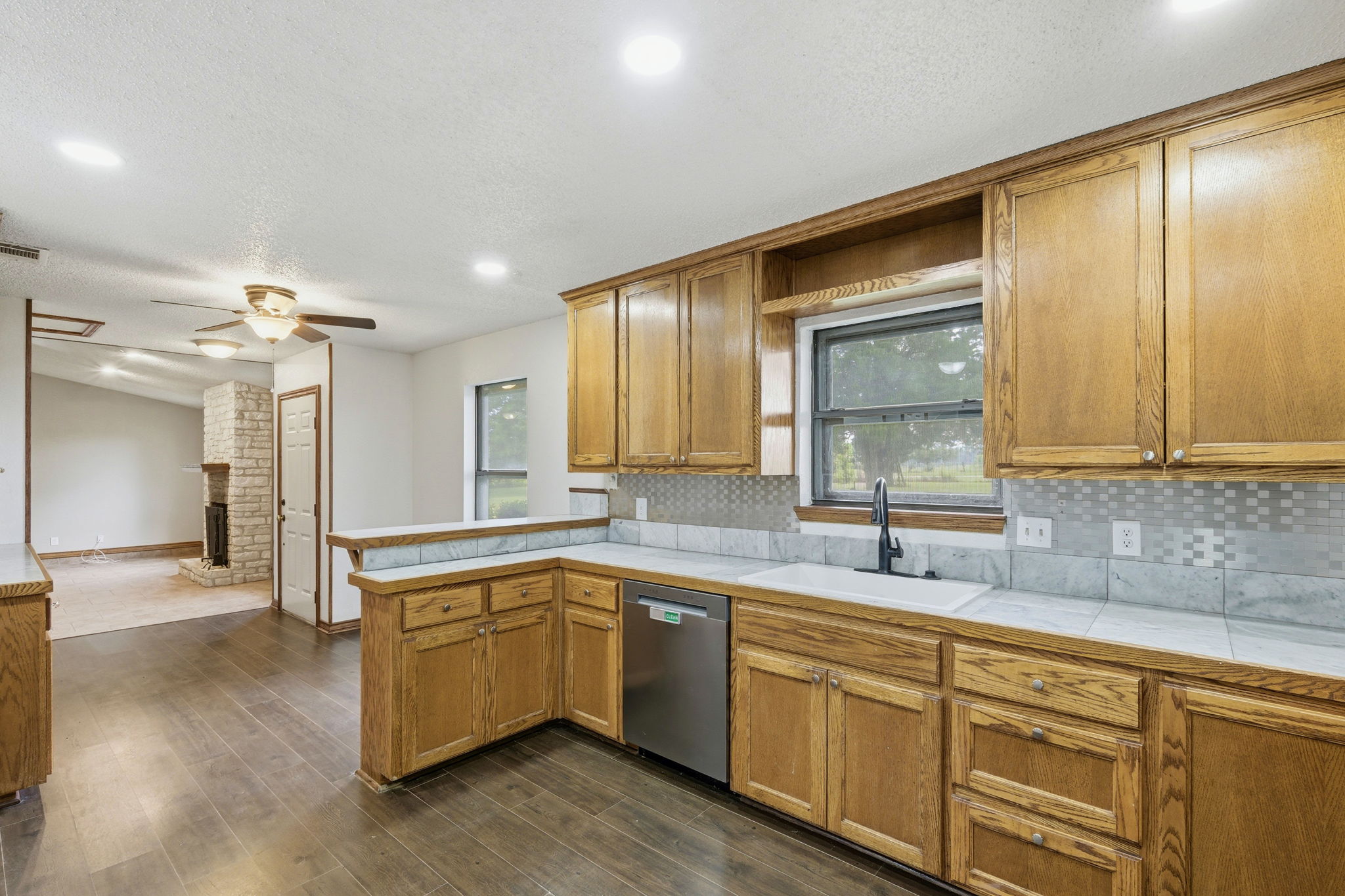 900 County Road 474 Elgin, TX 78621 - Photo 11 of 36 Kitchen looking out into Breakfast Area & Living Room