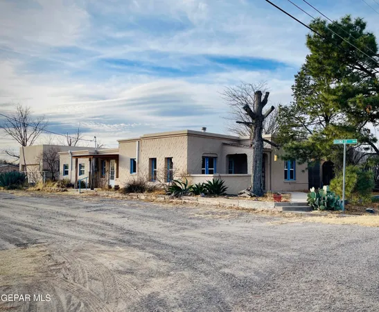 a wooden bench sitting in front of a building
