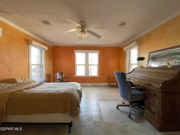 a bedroom with a bed and a table