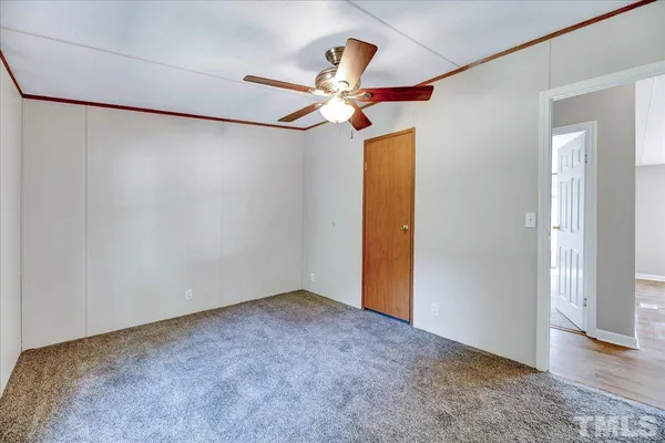 a view of a big room with carpet