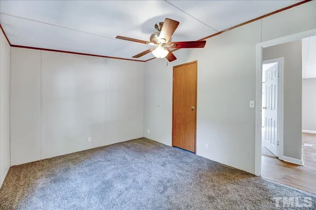 a view of a big room with carpet