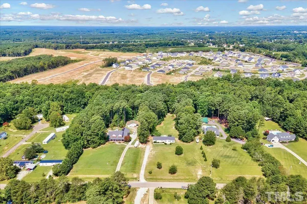 an aerial view of residential house with an outdoor space