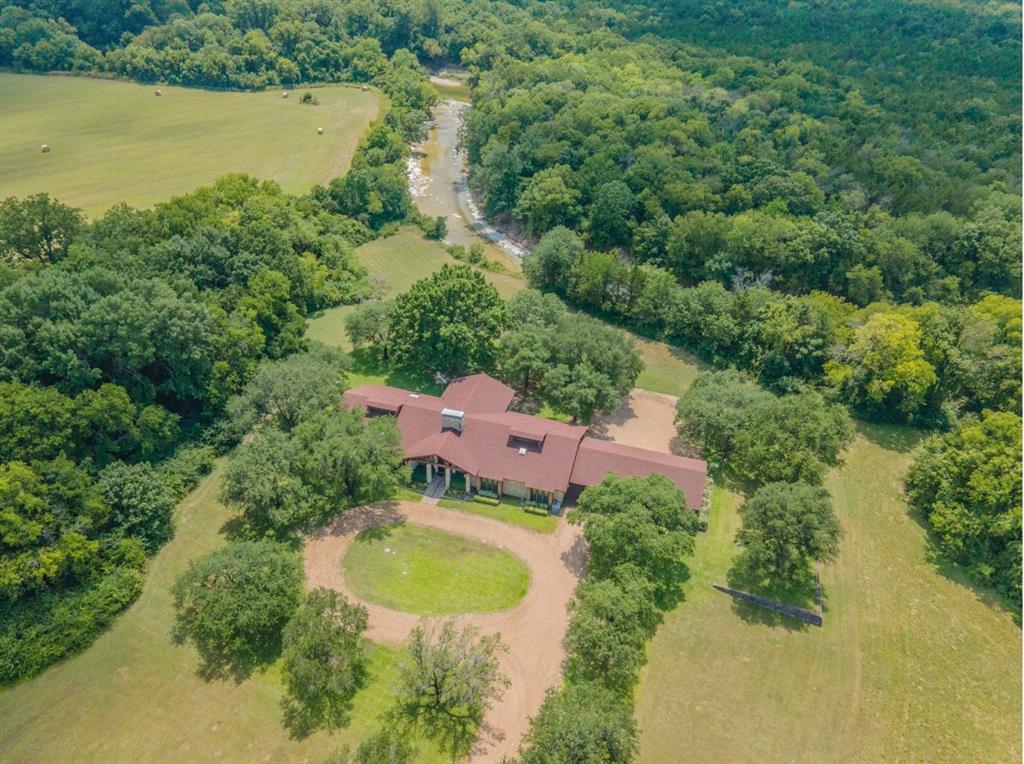 2300 West Main Street Lancaster, TX 75146 - Photo 1 of 22 an aerial view of a house with pool and a yard