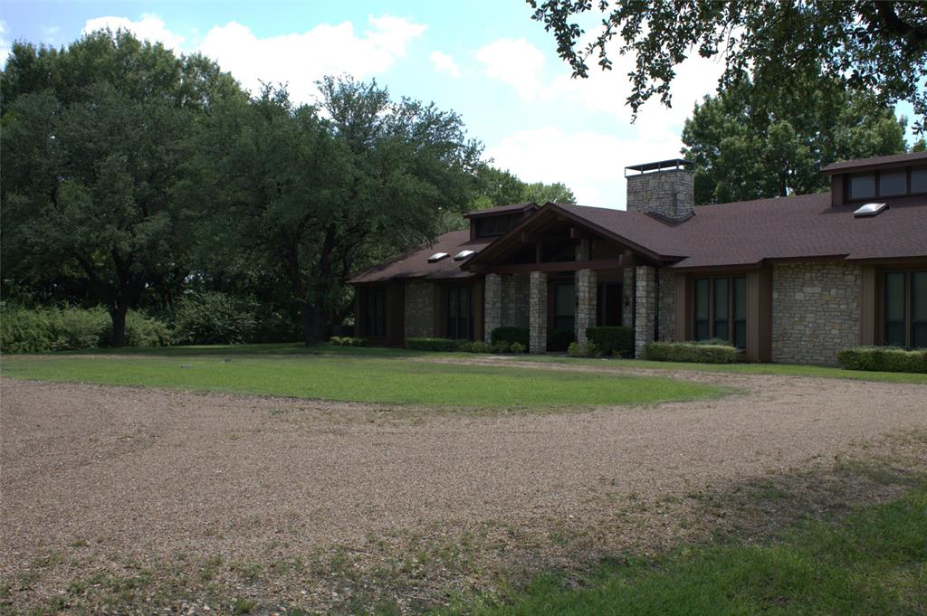 2300 West Main Street Lancaster, TX 75146 - Photo 17 of 22 a front view of a house with a yard and trees