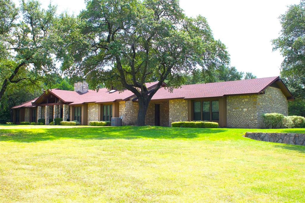 2300 West Main Street Lancaster, TX 75146 - Photo 3 of 22 a front view of a house with a yard and garage