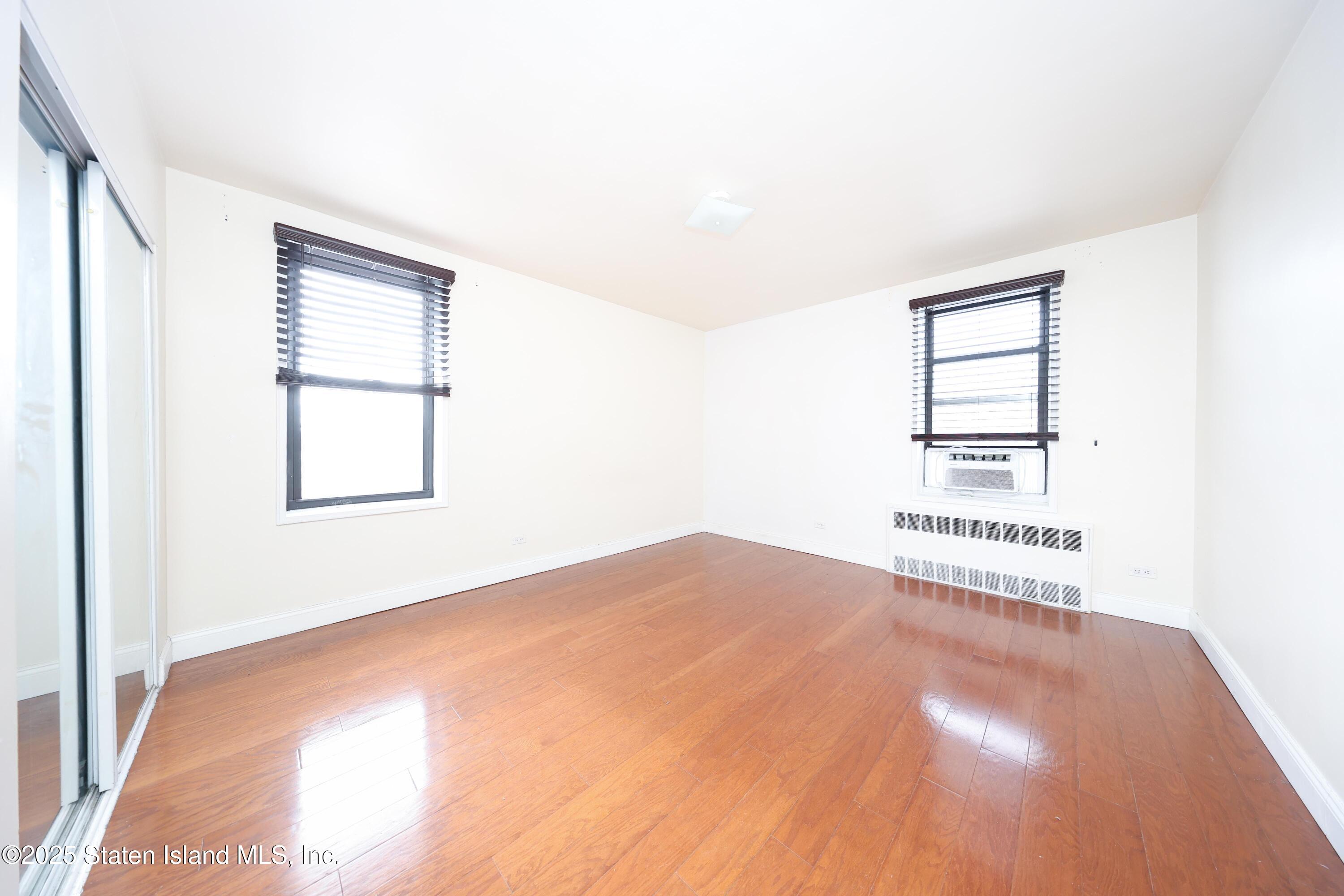 9040 Fort Hamilton Parkway, Unit 6C Brooklyn, NY 11209 - Photo 17 of 18 an empty room with windows