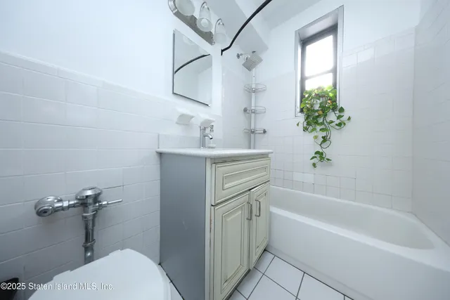 a bathroom with a sink a bathtub and a toilet