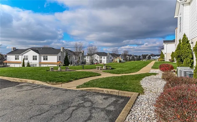 a view of an house with backyard and entertaining space
