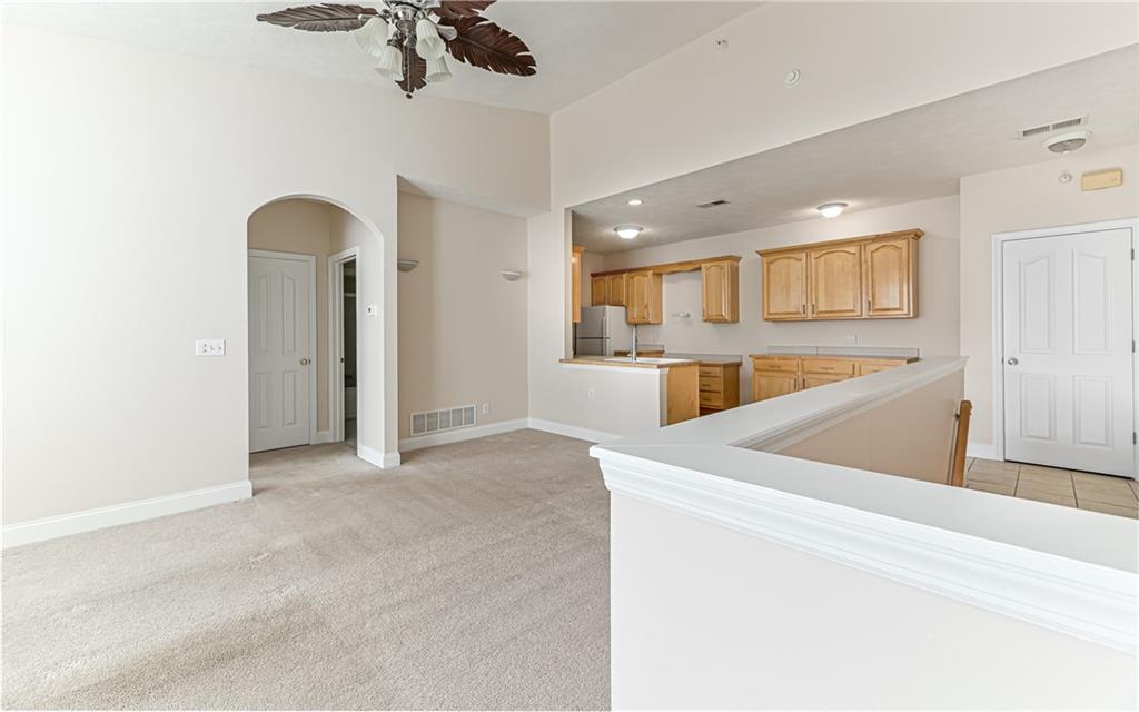 227 Adams Pointe Boulevard, Unit 3 Mars, PA 16046 - Photo 3 of 16 a view of kitchen with refrigerator and microwave