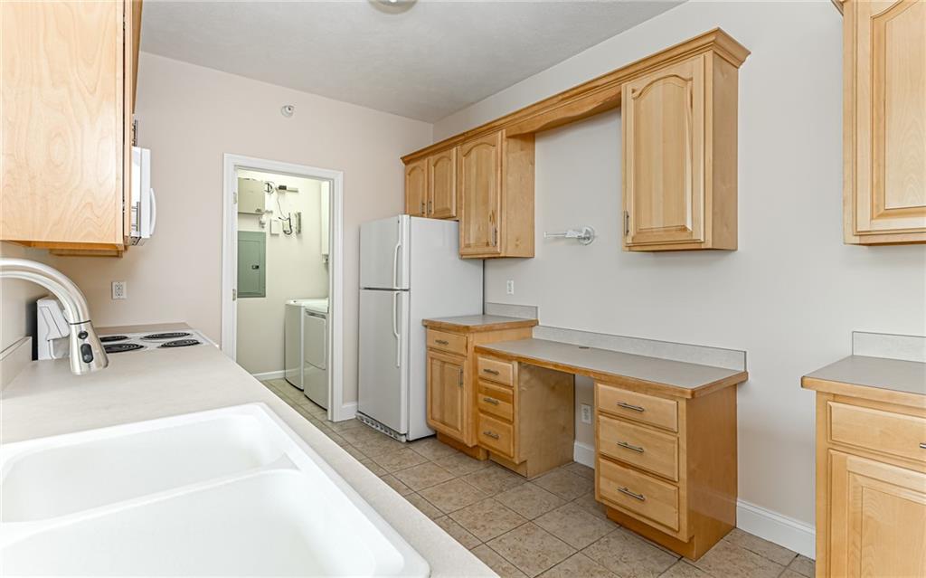 227 Adams Pointe Boulevard, Unit 3 Mars, PA 16046 - Photo 9 of 16 a kitchen with stainless steel appliances granite countertop a sink stove and refrigerator