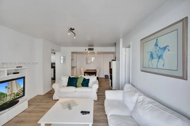 a view of kitchen with furniture and wooden floor
