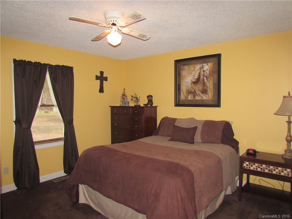 2030 Orchard Road Smyrna, SC 29743 - Photo 14 of 24 a bedroom with a bed and a window