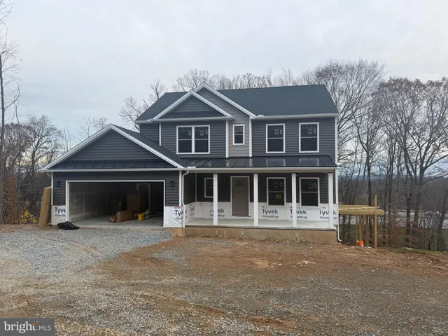 a front view of a house with a garage