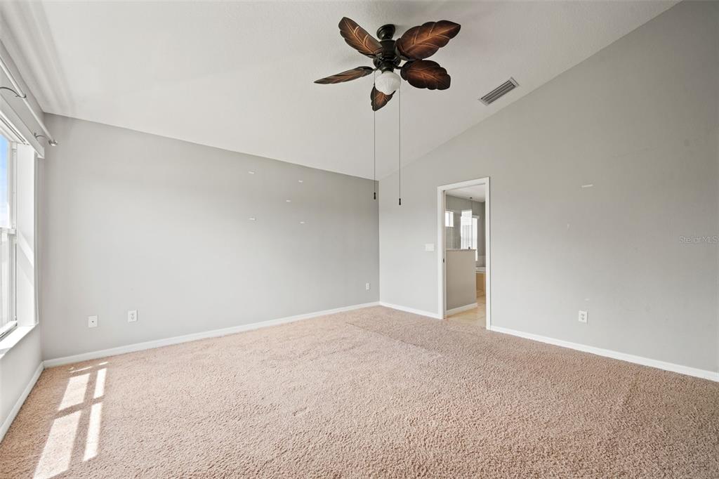 10909 Observatory Way Tampa, FL 33647 - Photo 22 of 39 a view of room with a ceiling fan and window