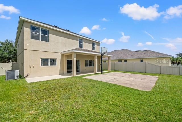 10909 Observatory Way Tampa, FL 33647 - Photo 37 of 39 a front view of a house with a yard and garage