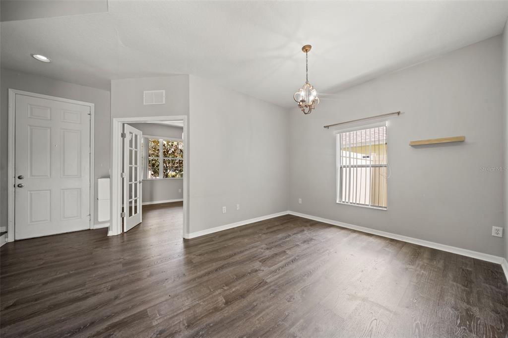 10909 Observatory Way Tampa, FL 33647 - Photo 4 of 39 wooden floor in an empty room with a window