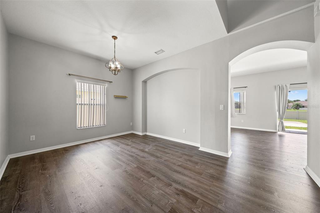 10909 Observatory Way Tampa, FL 33647 - Photo 8 of 39 a view of an empty room with window and wooden floor