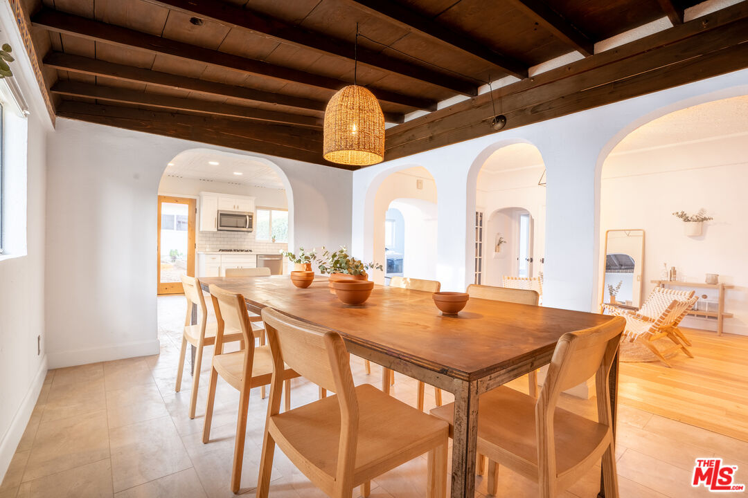 3201 Castera Avenue Glendale, CA 91208 - Photo 7 of 16 a view of a dining room with furniture and a chandelier