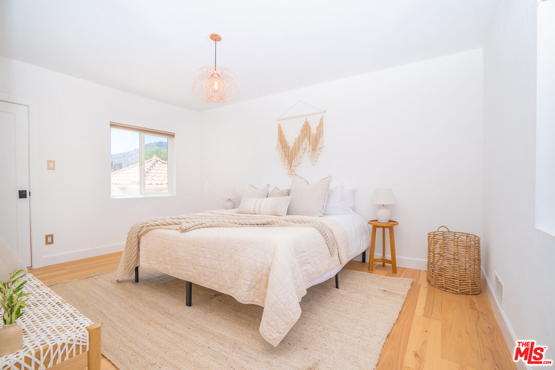 3201 Castera Avenue Glendale, CA 91208 - Photo 8 of 16 a spacious bedroom with a bed and a window