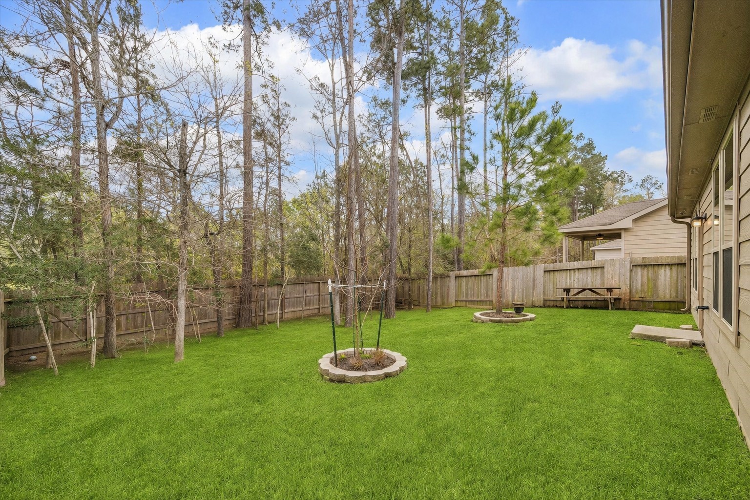 4275 Pine Still Road Conroe, TX 77304 - Photo 21 of 25 Grass virtually enhanced to show what extra sod would look like.