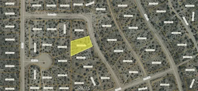 a aerial view of a residential apartment building with a yard