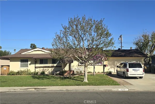 a car parked in front of a house