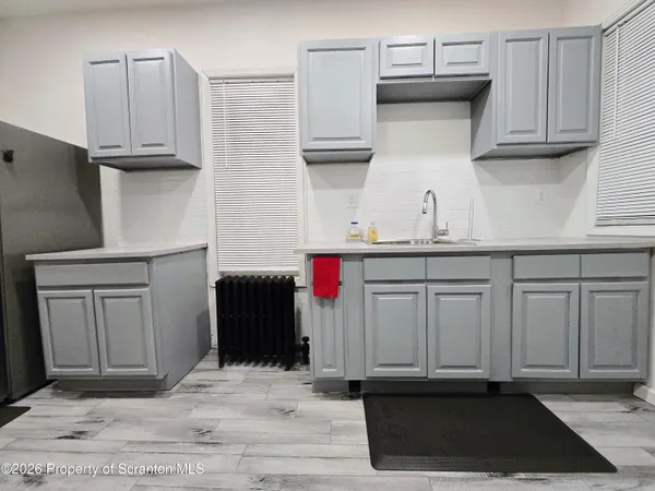 a kitchen with stainless steel appliances granite countertop a sink dishwasher stove and cabinets