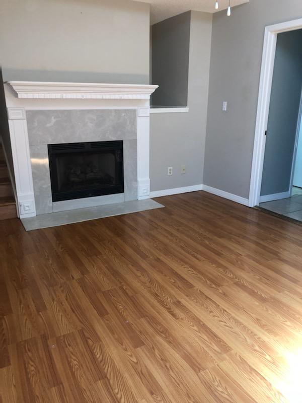 9 Falcon Ridge Lane, Unit 9 Fort Walton Beach, FL 32547 - Photo 2 of 23 a view of empty room with wooden floor and fireplace