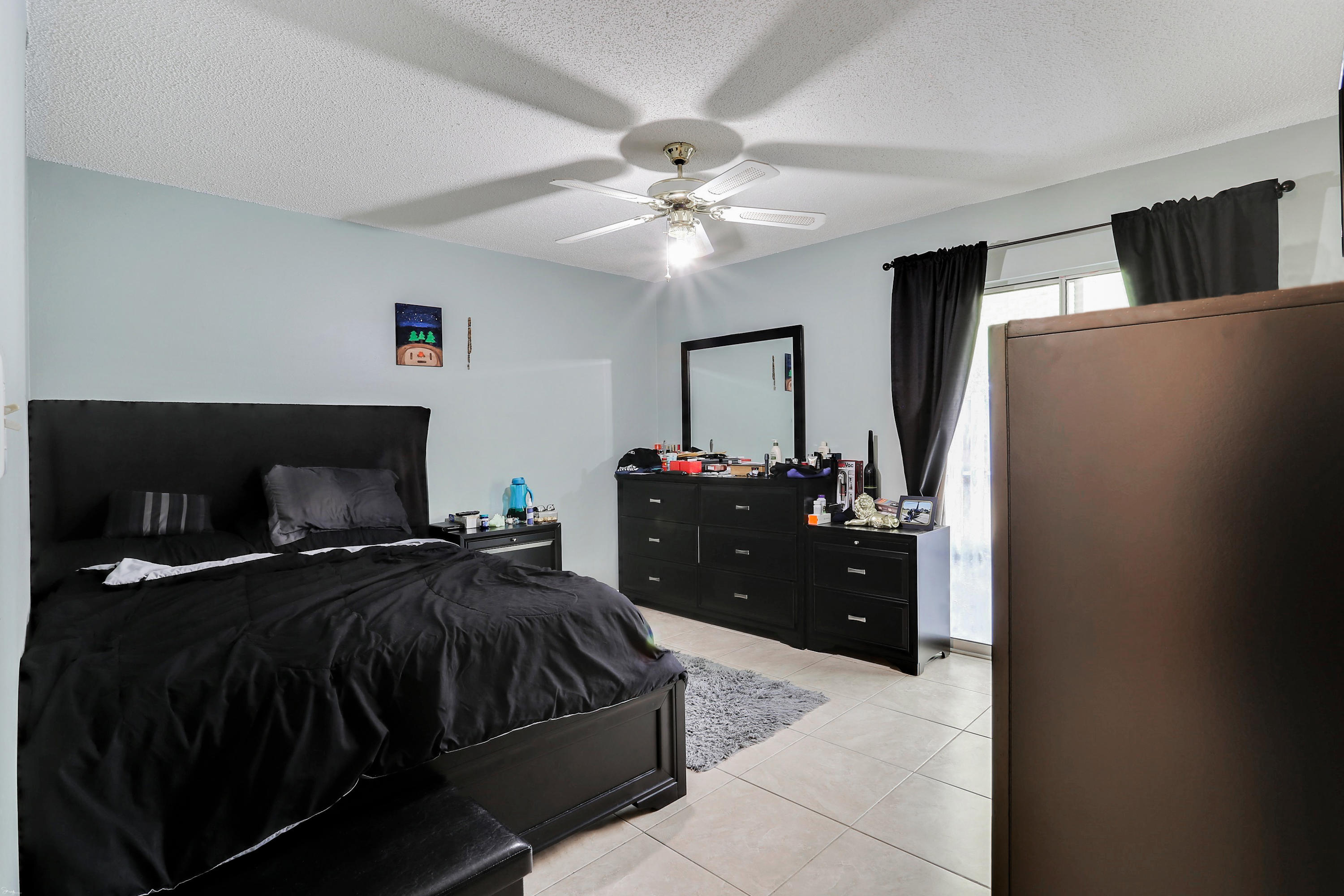 9 Falcon Ridge Lane, Unit 9 Fort Walton Beach, FL 32547 - Photo 13 of 23 a room with a bed and a double vanity
