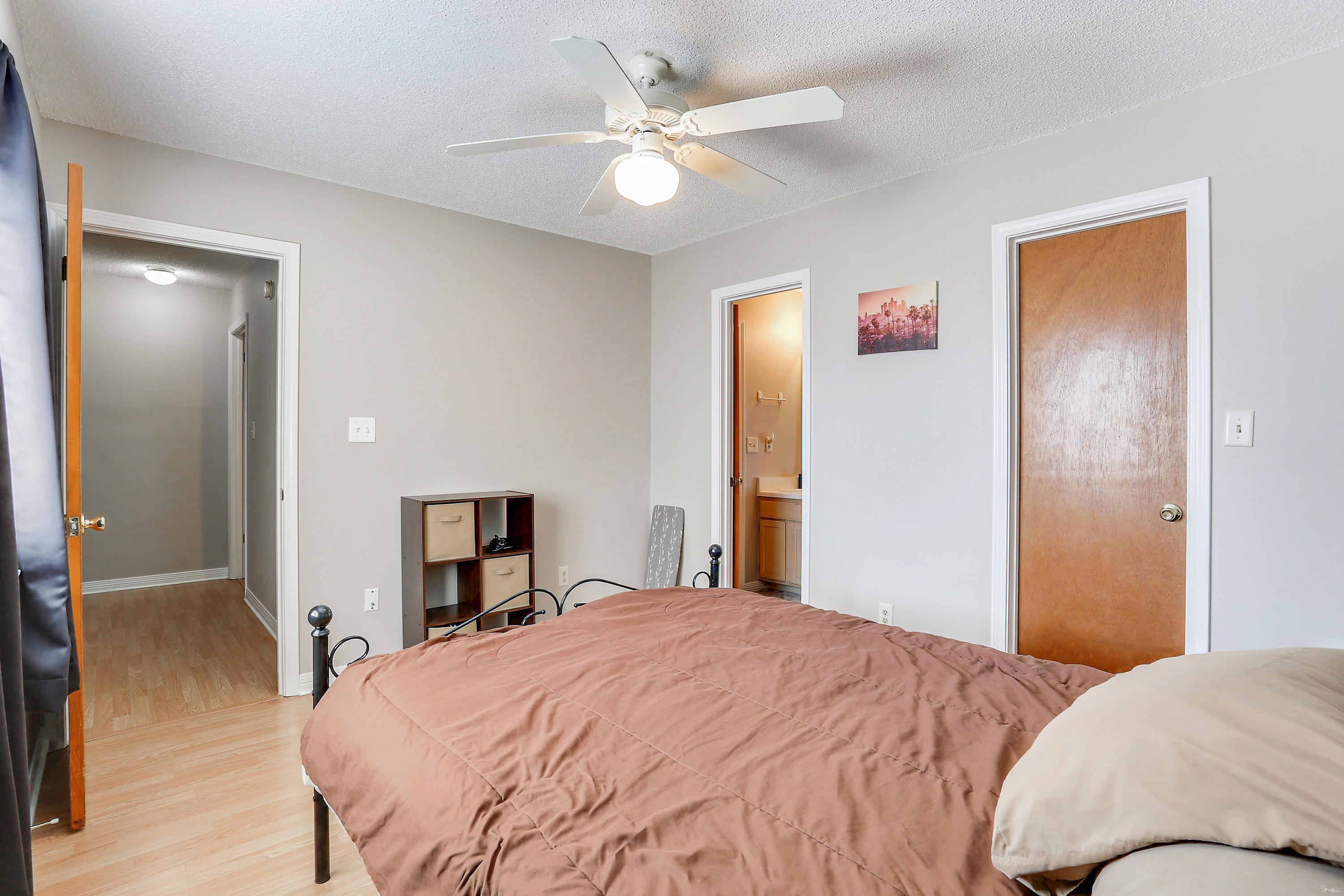 9 Falcon Ridge Lane, Unit 9 Fort Walton Beach, FL 32547 - Photo 17 of 23 a bedroom with a bed and a chandelier