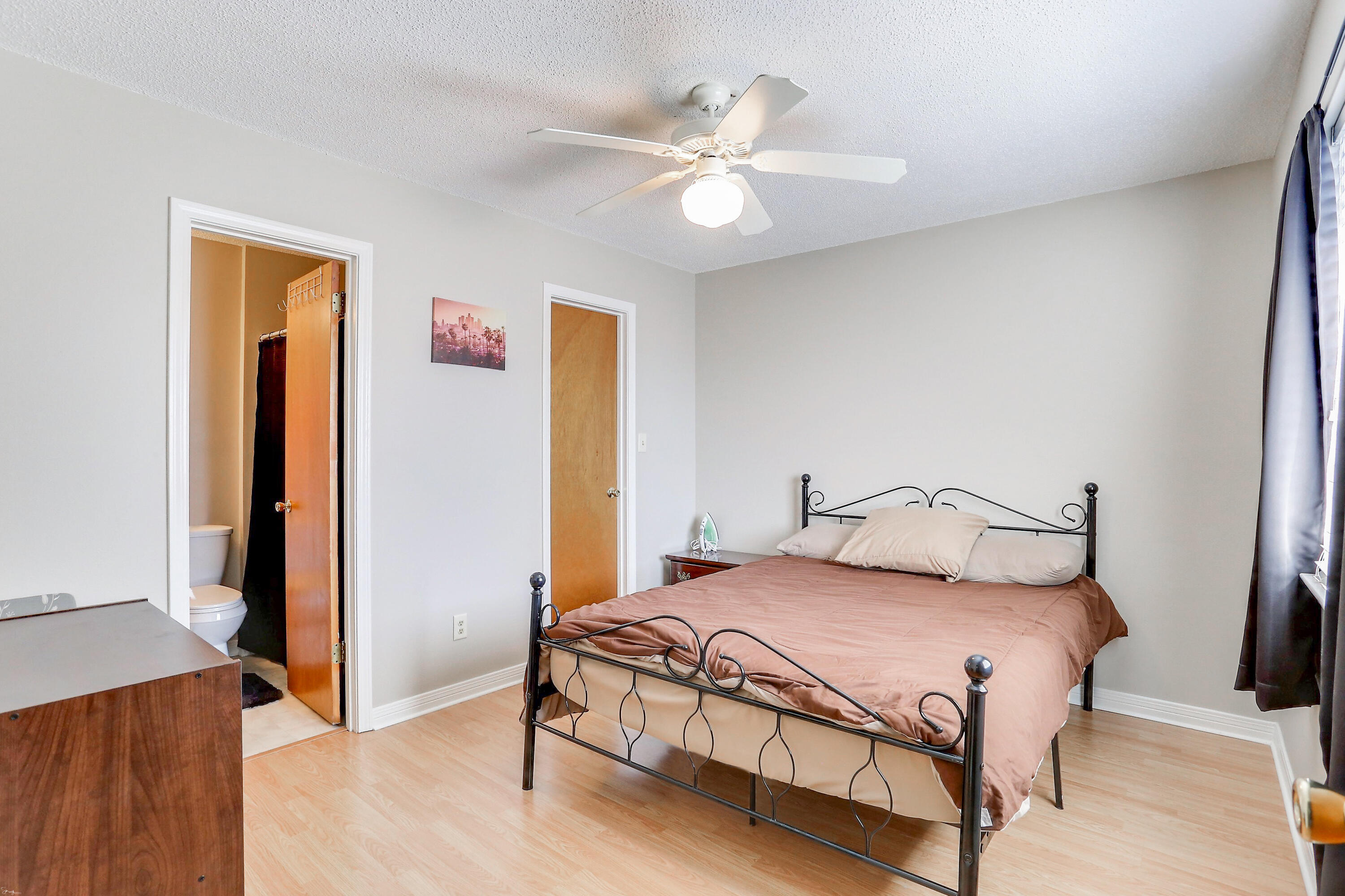 9 Falcon Ridge Lane, Unit 9 Fort Walton Beach, FL 32547 - Photo 20 of 23 a bedroom with a bed and a chandelier
