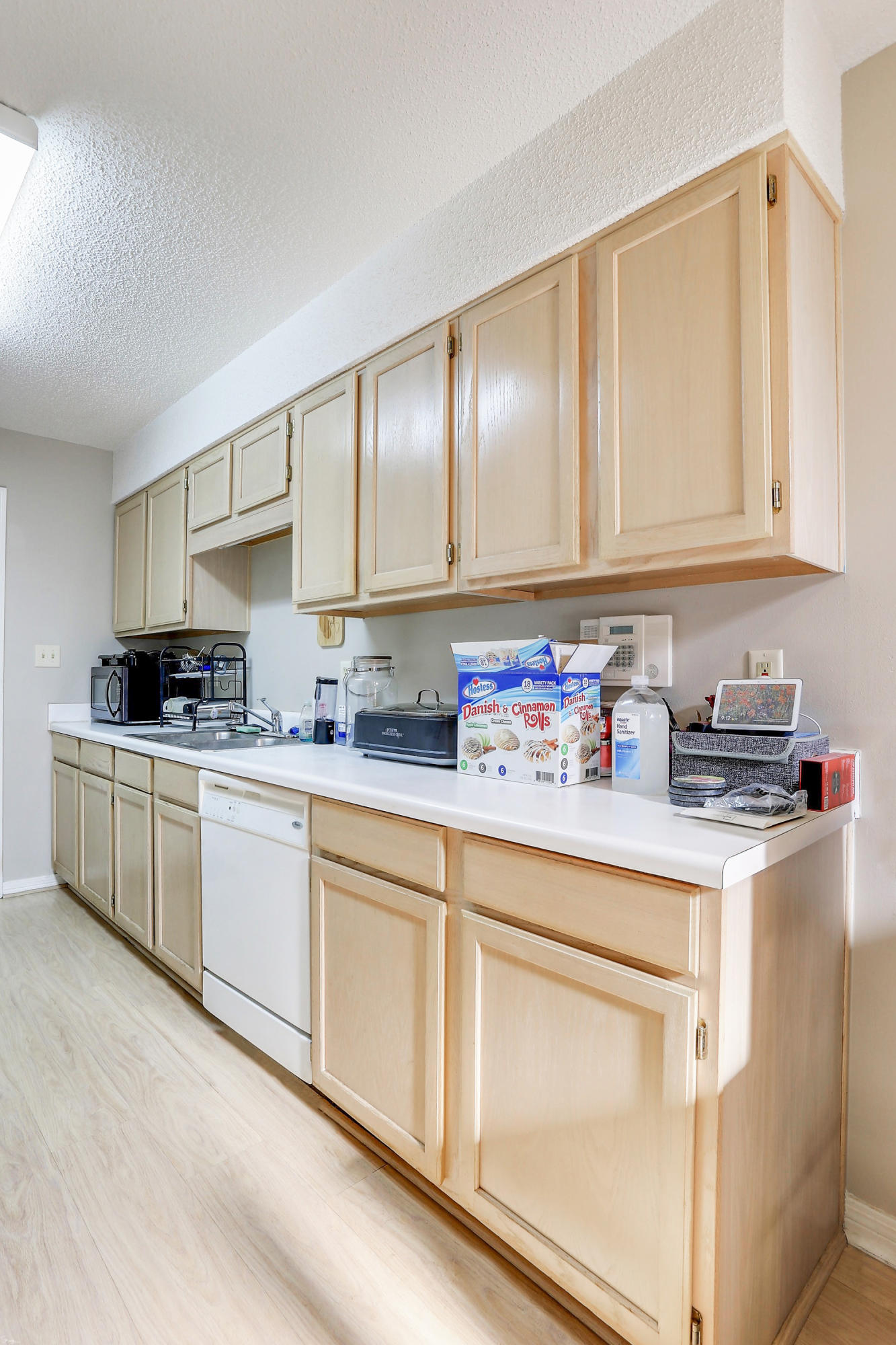 9 Falcon Ridge Lane, Unit 9 Fort Walton Beach, FL 32547 - Photo 7 of 23 a kitchen with granite countertop cabinets sink and white appliances