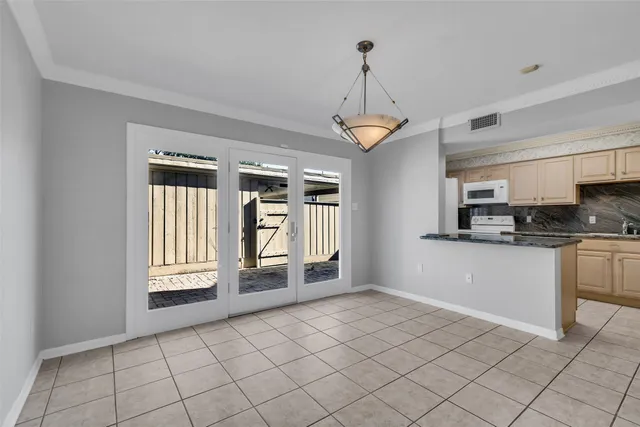 a view of a hallway with a chandelier