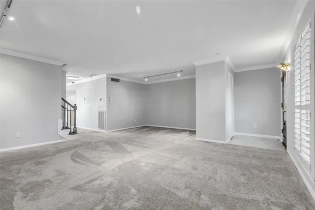 a kitchen with granite countertop a sink stove and cabinets