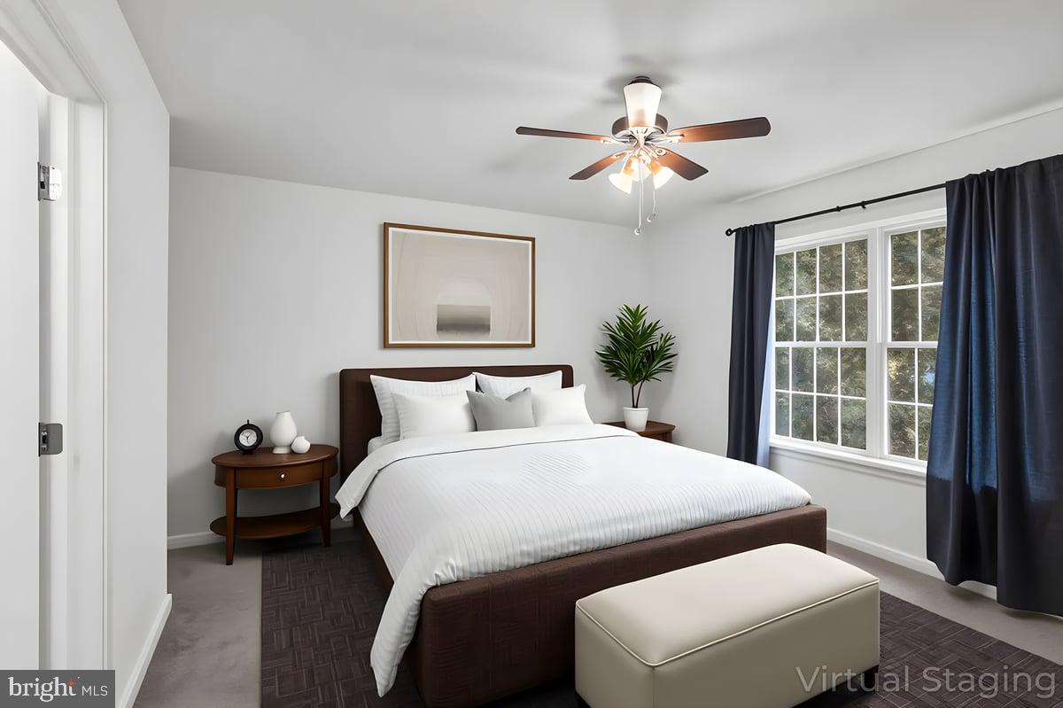 205 East Main Street Brownstown, PA 17508 - Photo 11 of 27 a bedroom with a bed and wooden floor