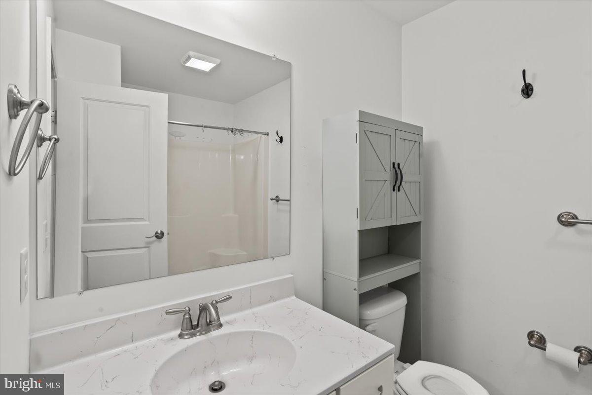 205 East Main Street Brownstown, PA 17508 - Photo 13 of 27 a bathroom with a sink toilet and shower