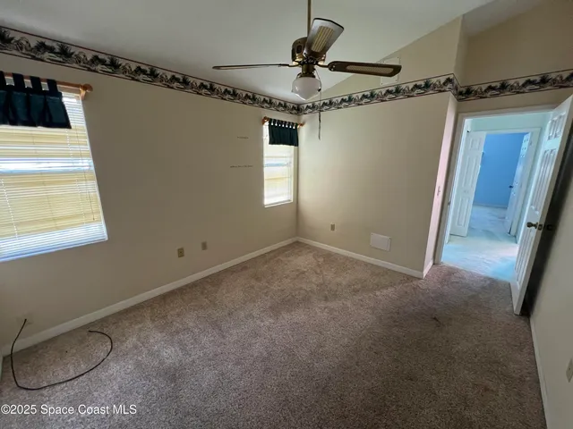 a view of a closet area with windows