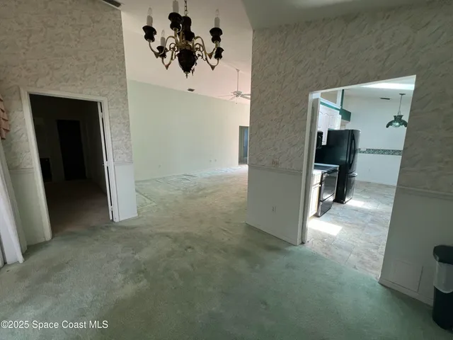 a view of a hallway view with staircase