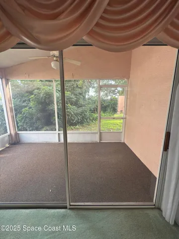 a view of a room with an outdoor space