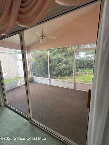 a view of a room with a large window