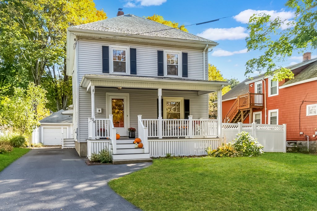 front view of a house with a yard