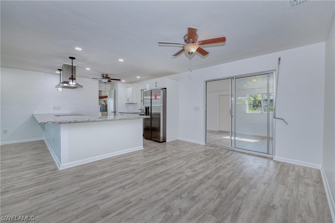 7246 Jonas Road Fort Myers, FL 33967 - Photo 7 of 27 a view of a kitchen with a sink and wooden floor