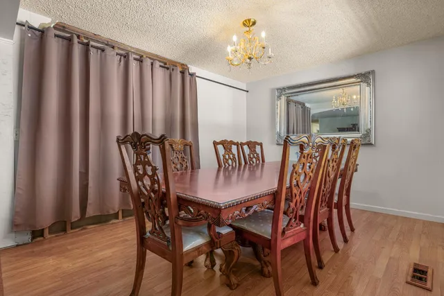 a view of a livingroom with furniture and wooden floor