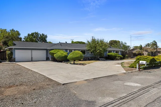 a view of a street with a car parked in front of it