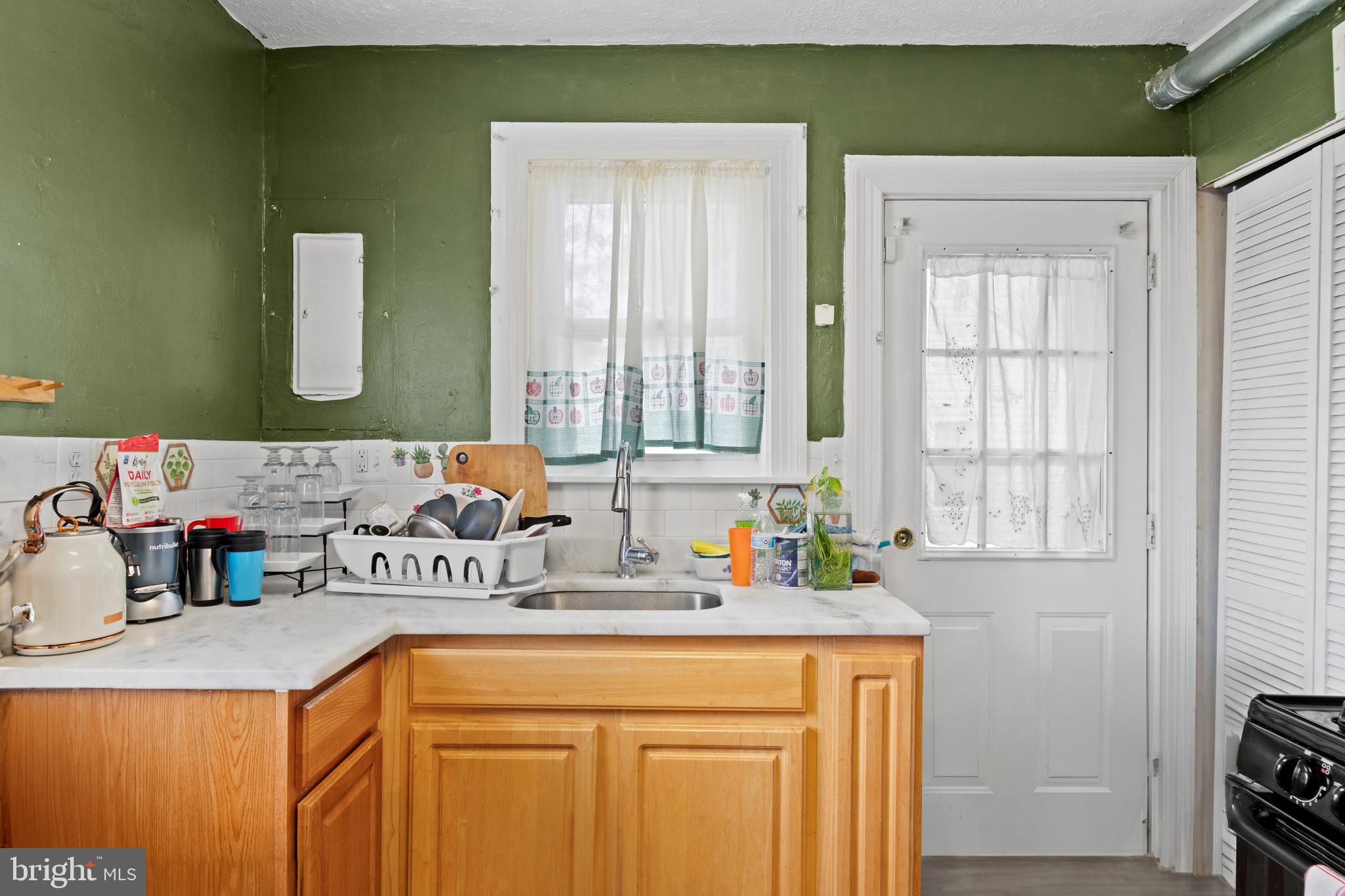 4410 Allies Road Suitland, MD 20746 - Photo 12 of 30 a bathroom with a sink a mirror and a window