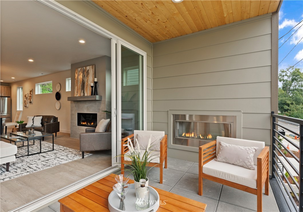 4558 22nd Avenue Southwest Seattle, WA 98106 - Photo 12 of 38 a living room with furniture and a fireplace