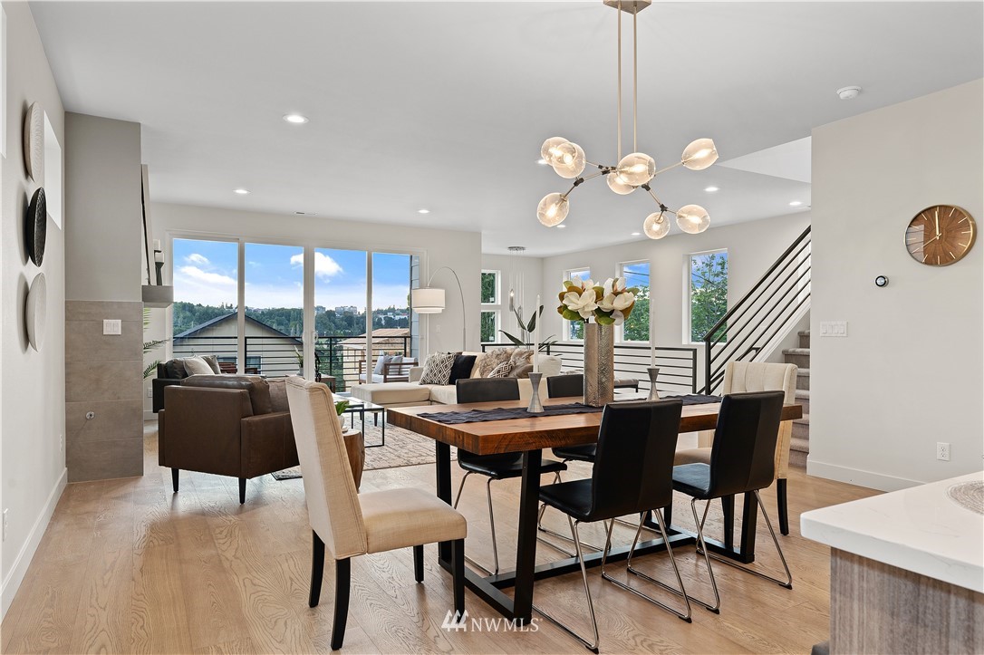 4558 22nd Avenue Southwest Seattle, WA 98106 - Photo 18 of 38 a view of a dining room with furniture and a large window