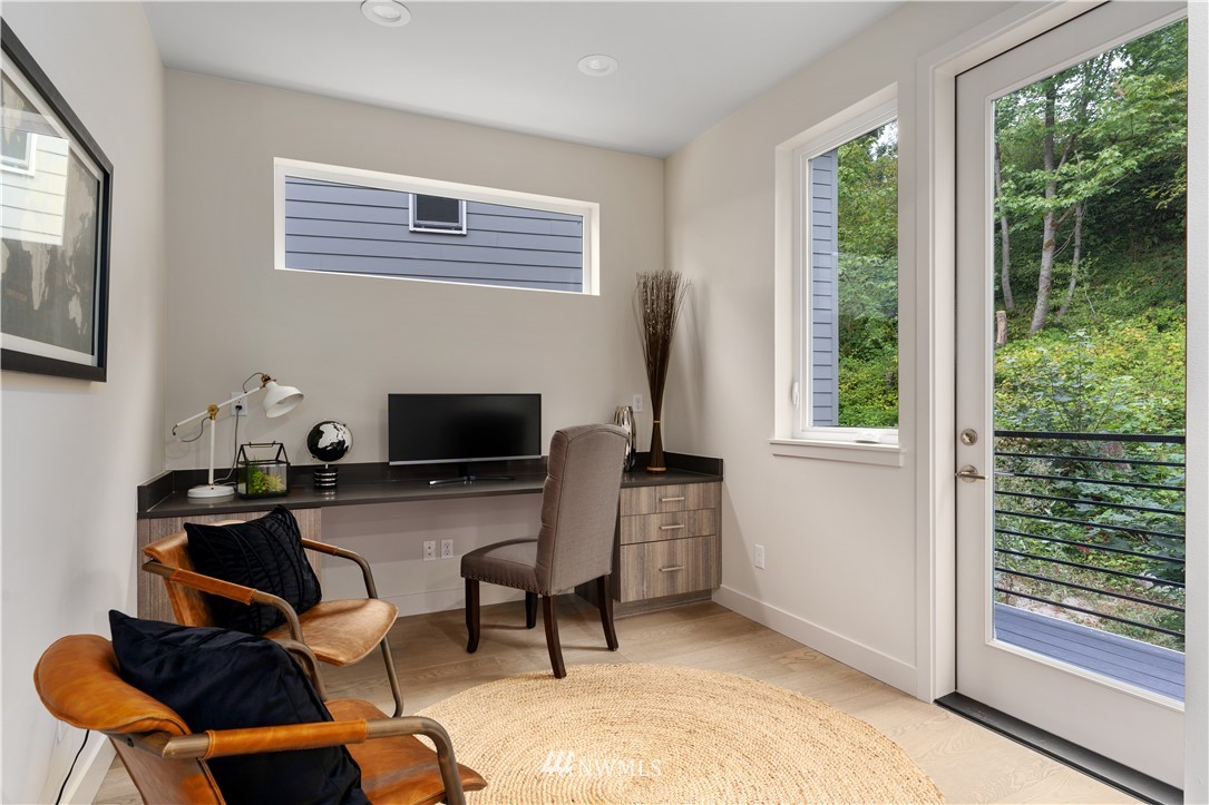 4558 22nd Avenue Southwest Seattle, WA 98106 - Photo 24 of 38 a workspace with furniture and a window