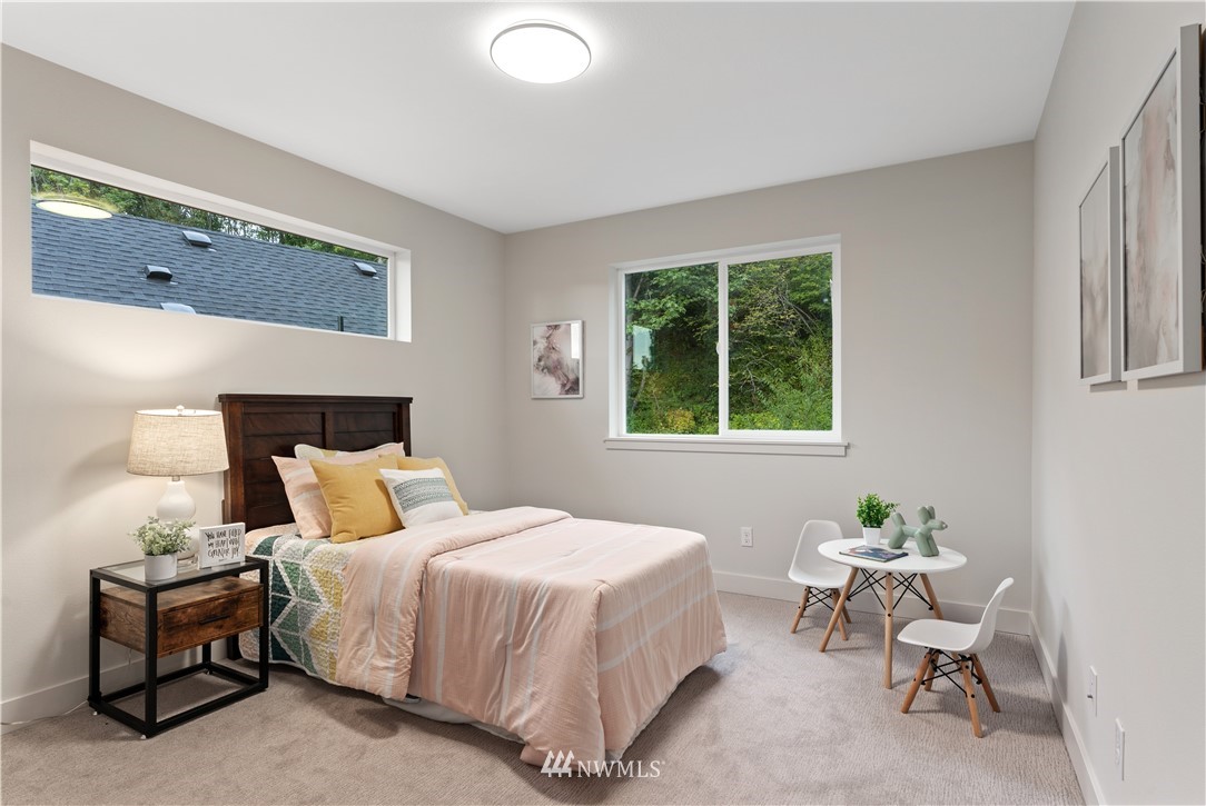 4558 22nd Avenue Southwest Seattle, WA 98106 - Photo 26 of 38 a bedroom with a bed and a window